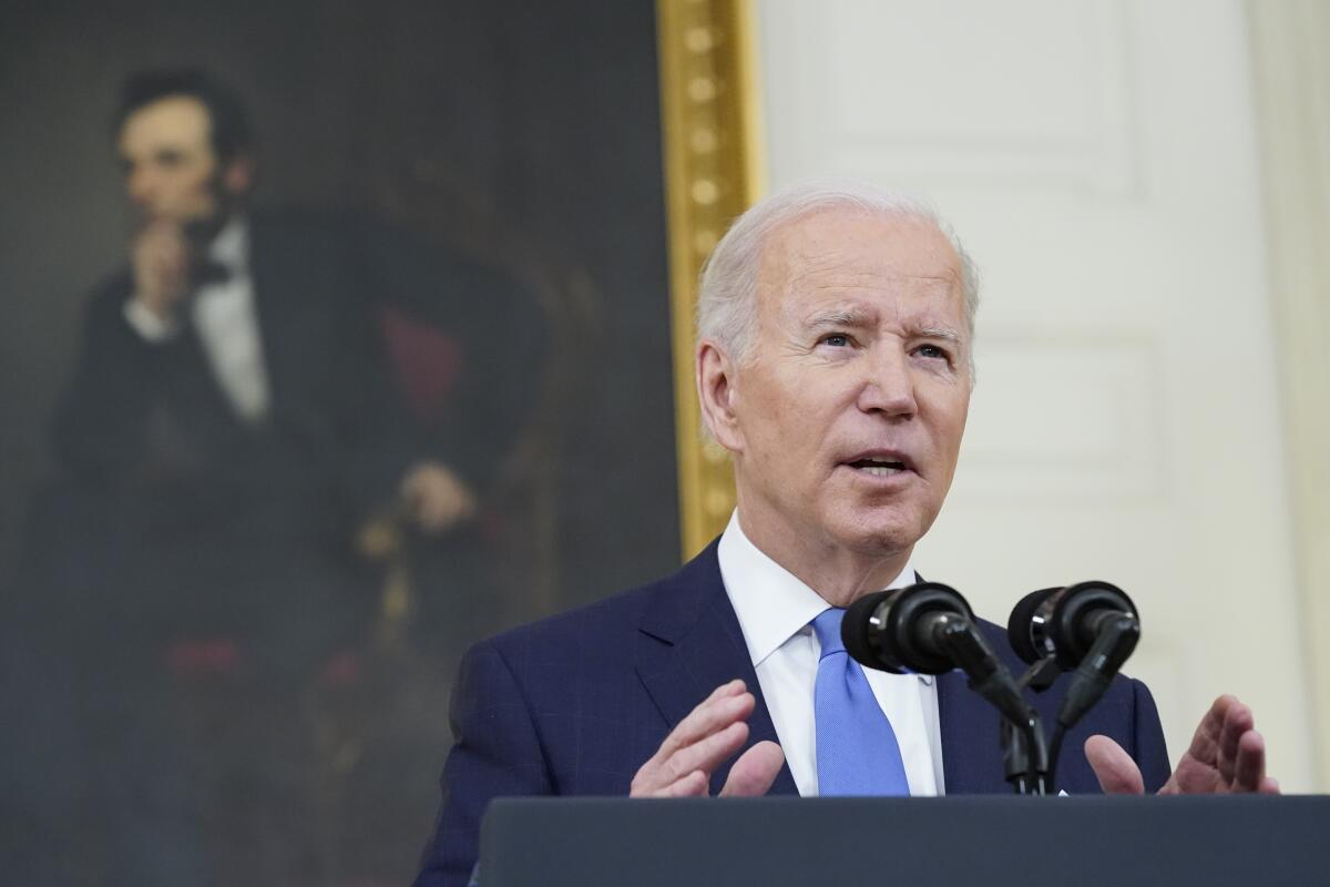 President Biden speaks at a podium