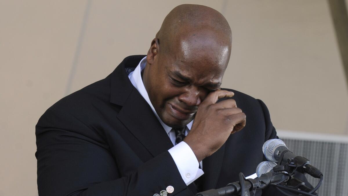Baseball great Frank Thomas wipes away tears as he speaks during Sunday's Baseball Hall of Fame induction ceremony in Cooperstown, N.Y.