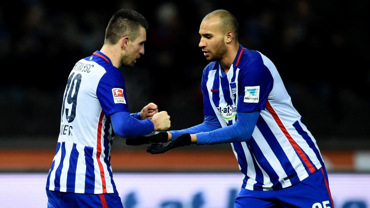 Hertha defender John Anthony Brooks, right congratulates teammate Vedad Ibisevic after scoring against Schalke 04 during a Bundesliga game on March 11.