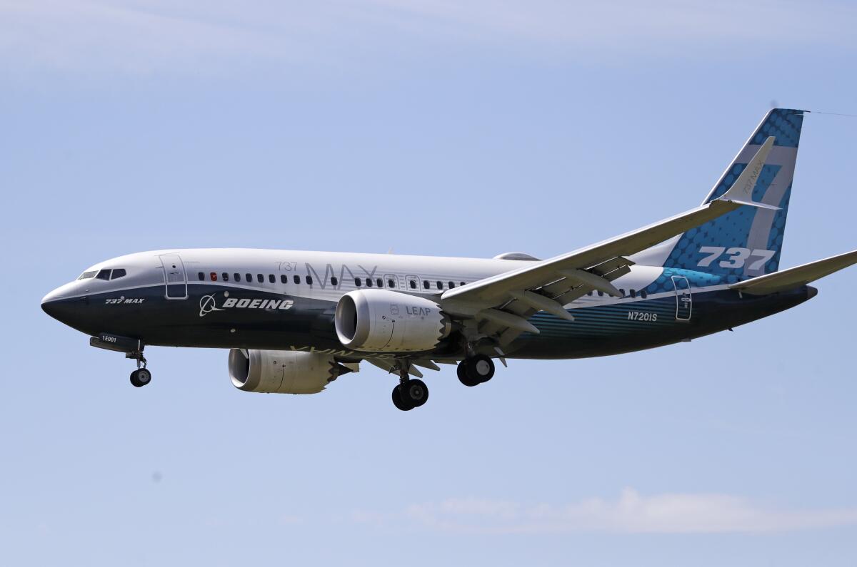 A Boeing 737 Max jet heads to Boeing Field in Seattle following a test flight on June 29.