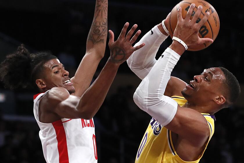 Los Angeles, CA, Tuesday, November 2, 2021 - Houston Rockets guard Jalen Green (0) defends Los Angeles Lakers guard Russell Westbrook (0) in the first quarter at Staples Center. (Robert Gauthier/Los Angeles Times)