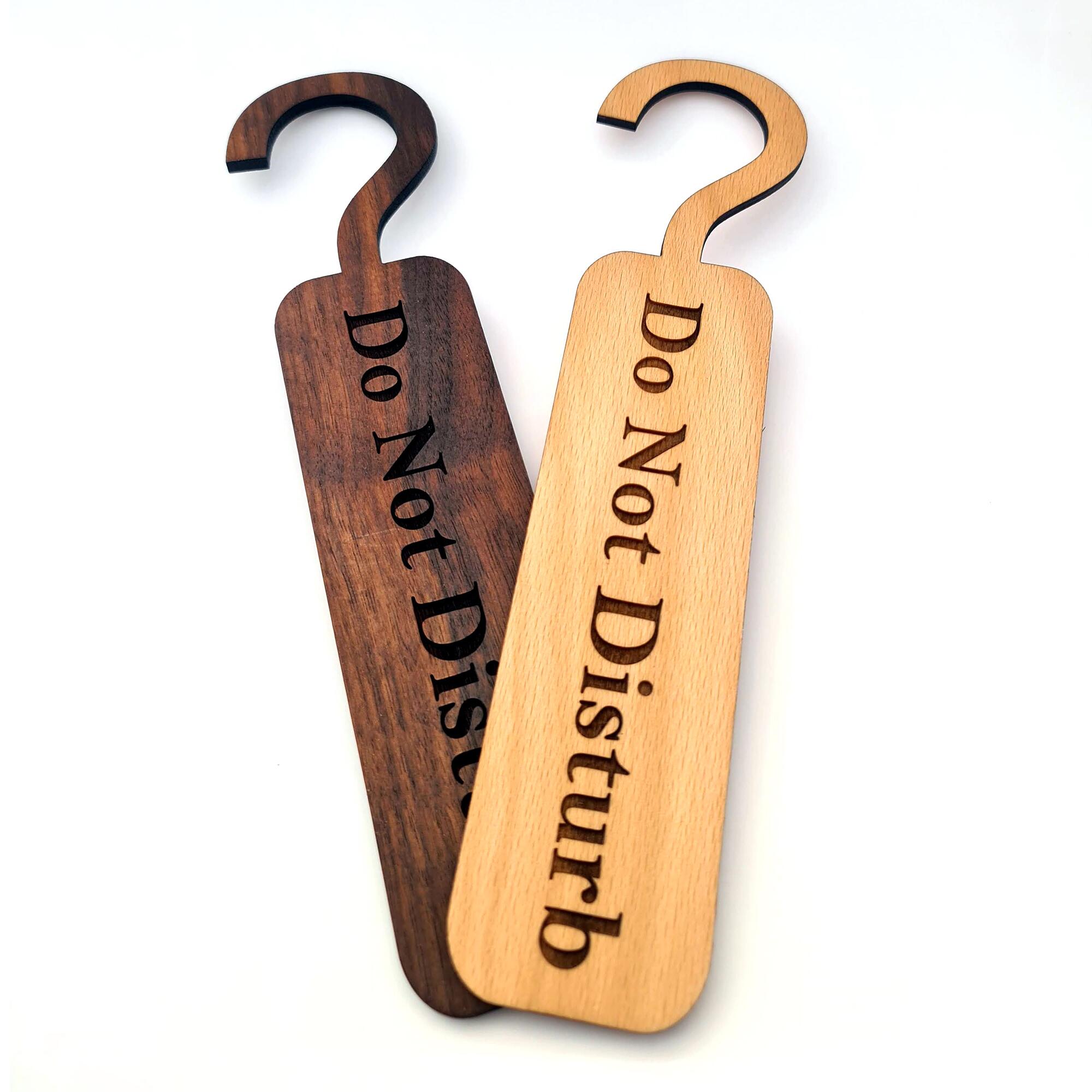 Wooden door tags with "Do Not Disturb" inscribed.