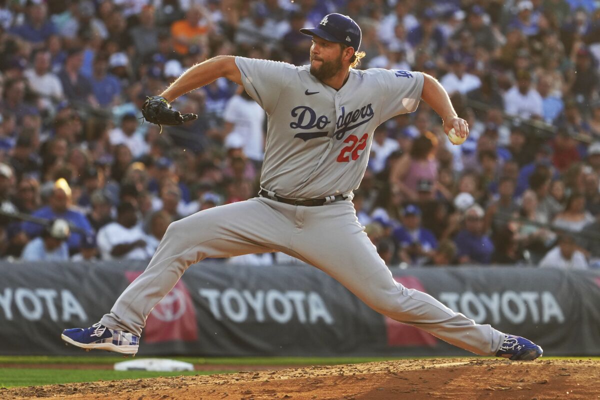 Los Angeles Dodgers starting pitcher Clayton Kershaw (22) throws against the Colorado Rockies.