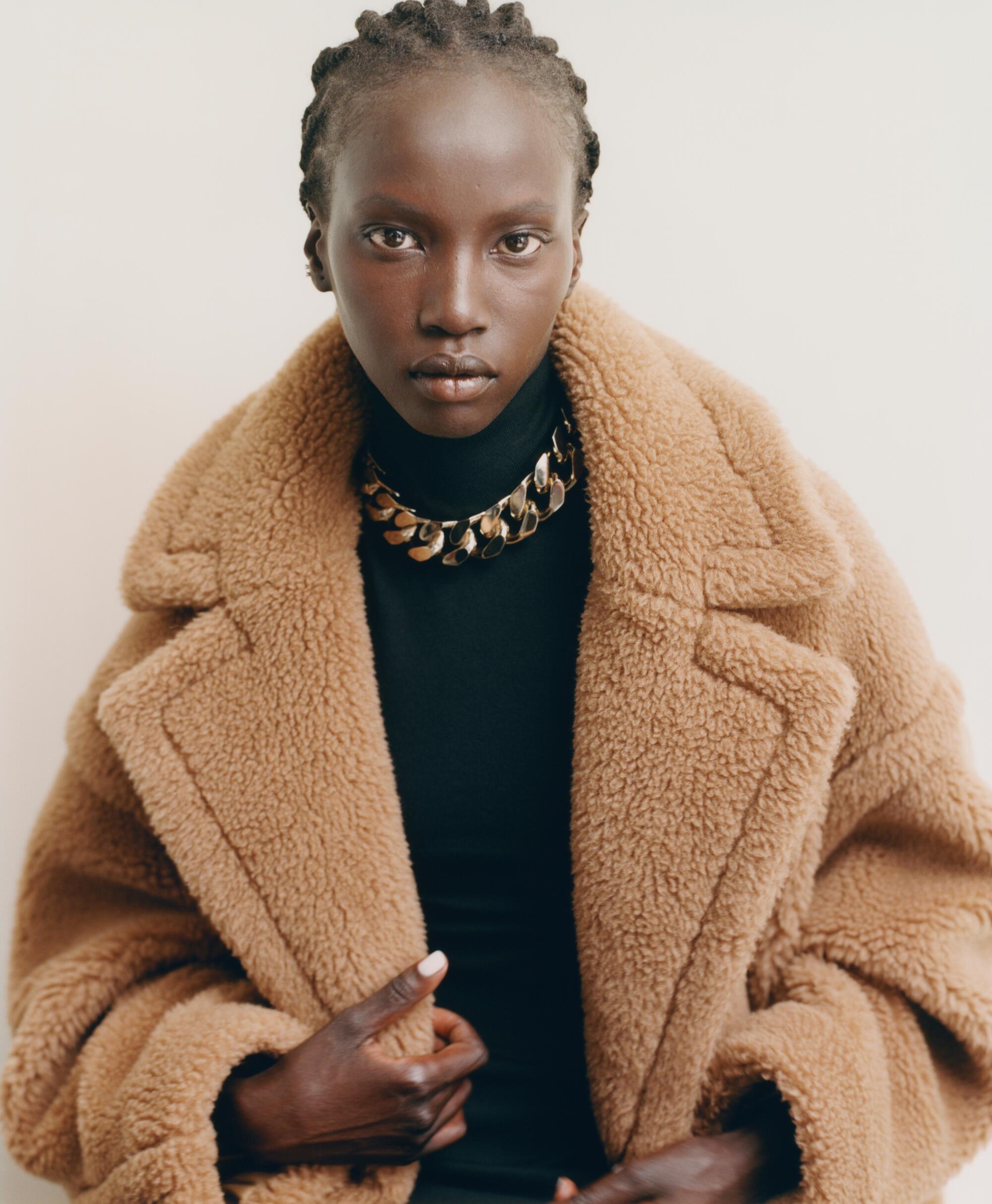 a model wears a brown Max Mara's Teddy Coat