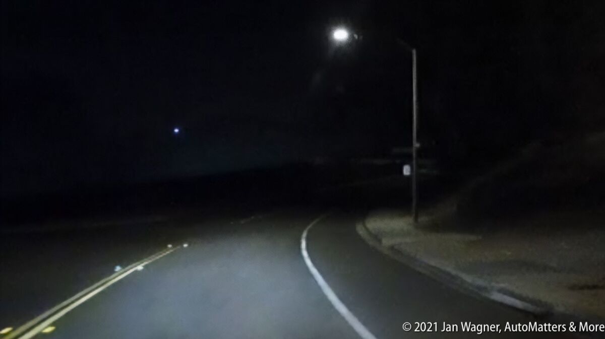 Right turn on a dark two-lane road