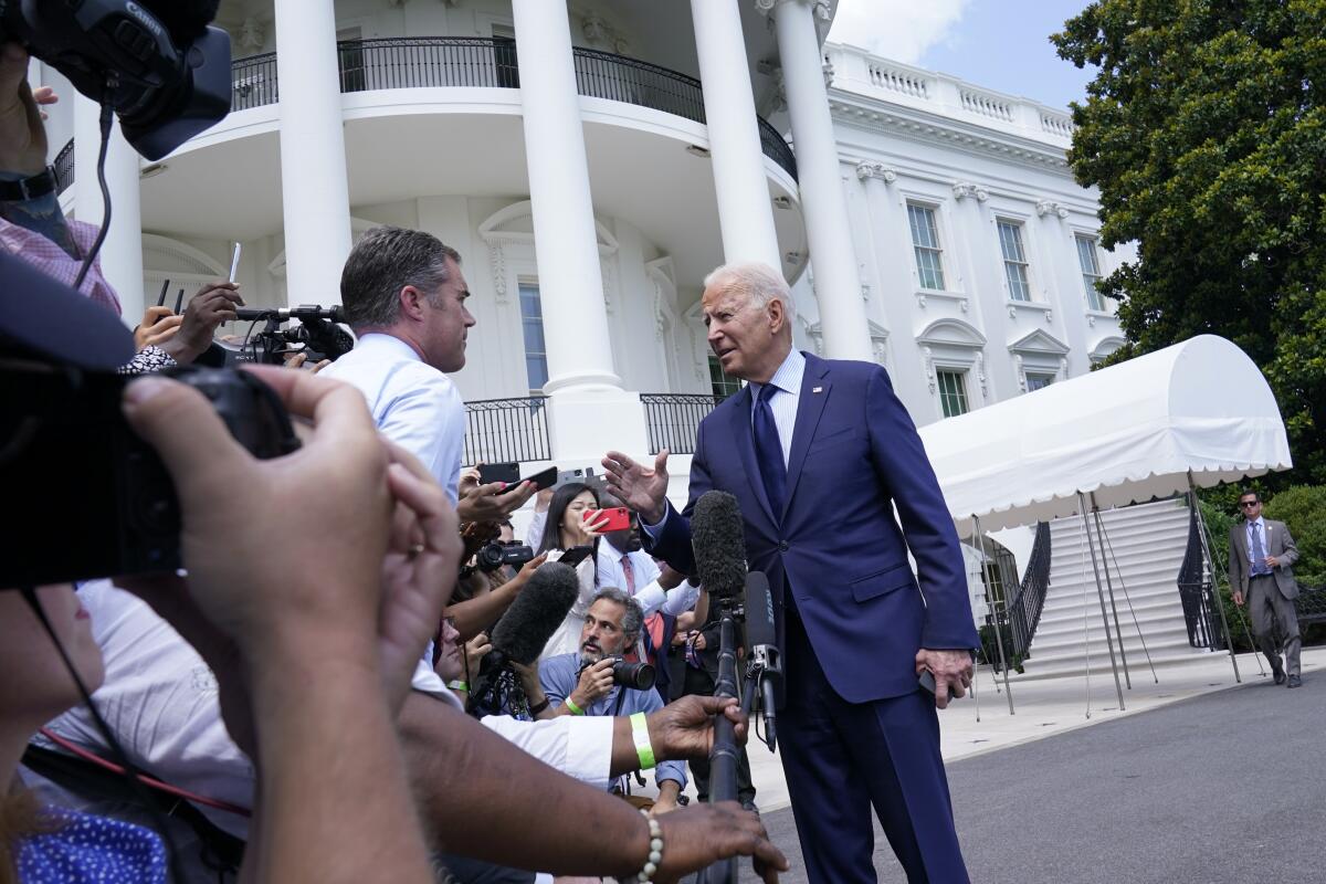 President Biden talks with reporters