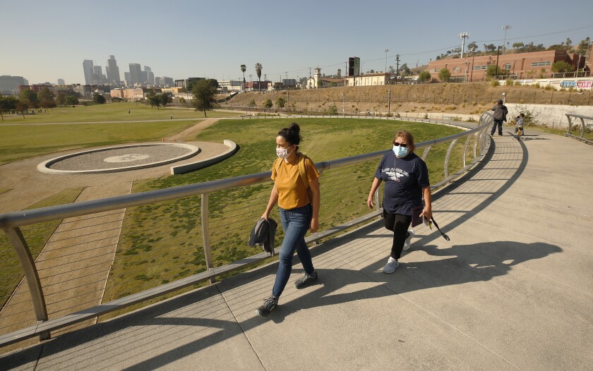 People are on a walkway at Los Angeles State Historic Park  near downtown L.A. 