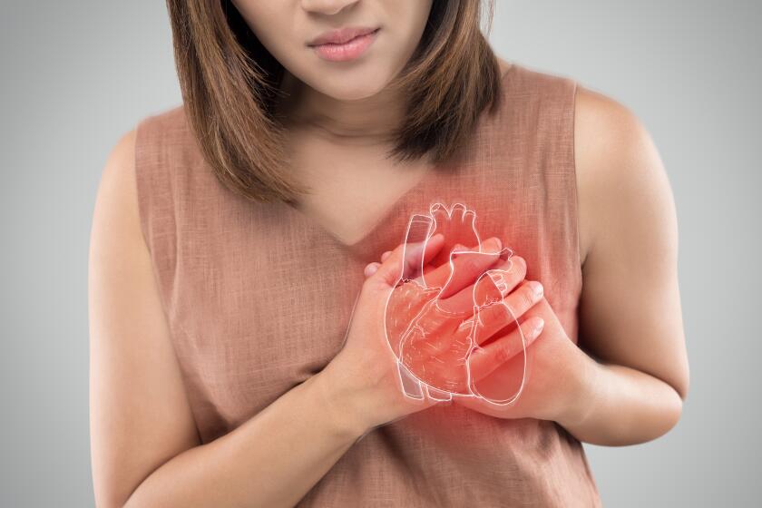 The photo of heart is on the woman's body, Severe heartache, Having heart attack or Painful cramps