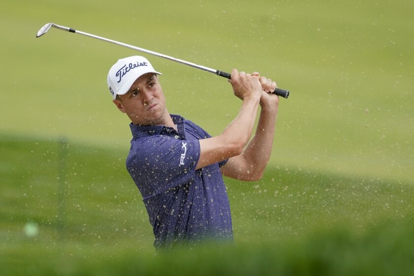 Justin Thomas, of the United States, plays a shot from a bunker on the 17th hole during the first round of the US Open Golf Championship, Thursday, Sept. 17, 2020, in Mamaroneck, N.Y. (AP Photo/Charles Krupa)