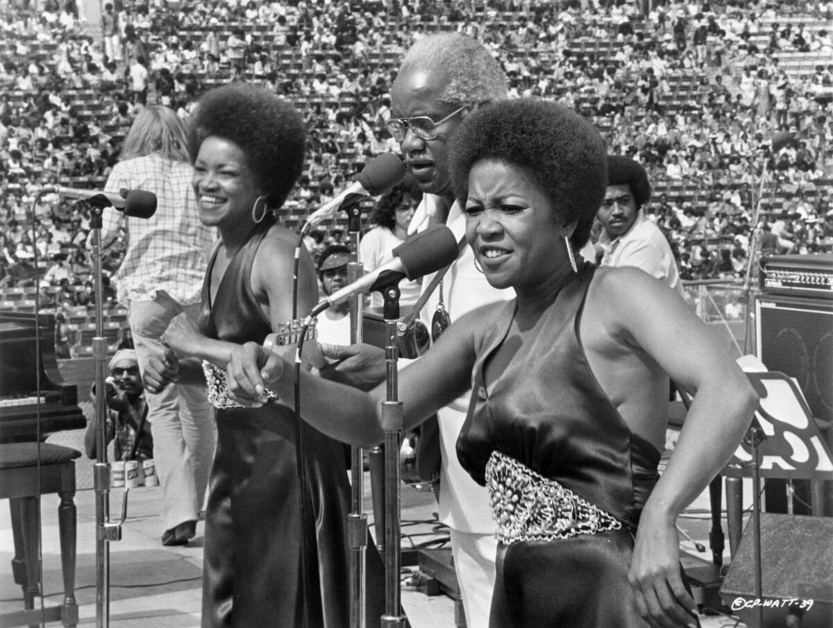  A Black soul group performs on an outdoor stage in the early 1970s. 