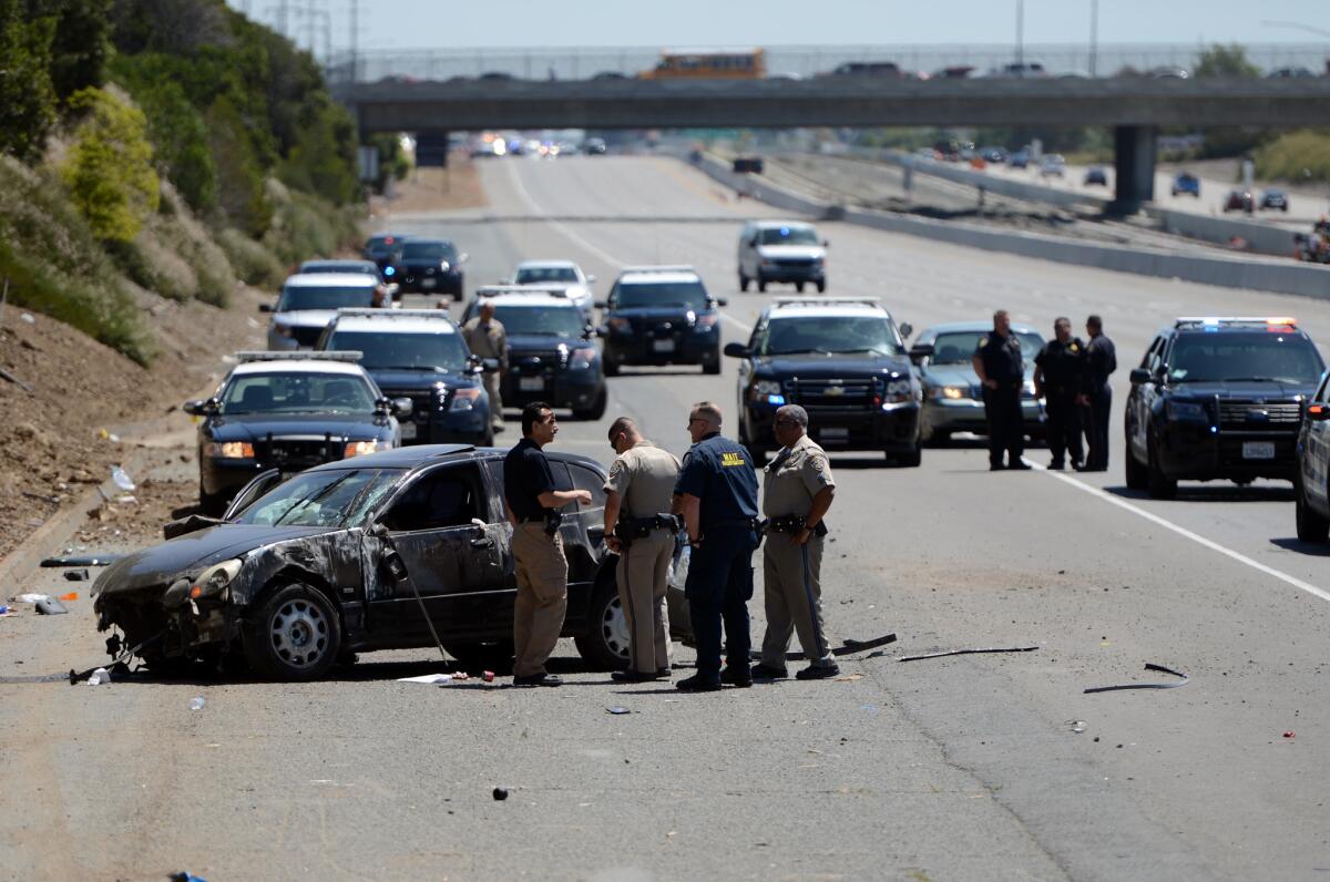Emergency personnel investigate the scene of a shooting May 11 on westbound California 4 in Pittsburg.