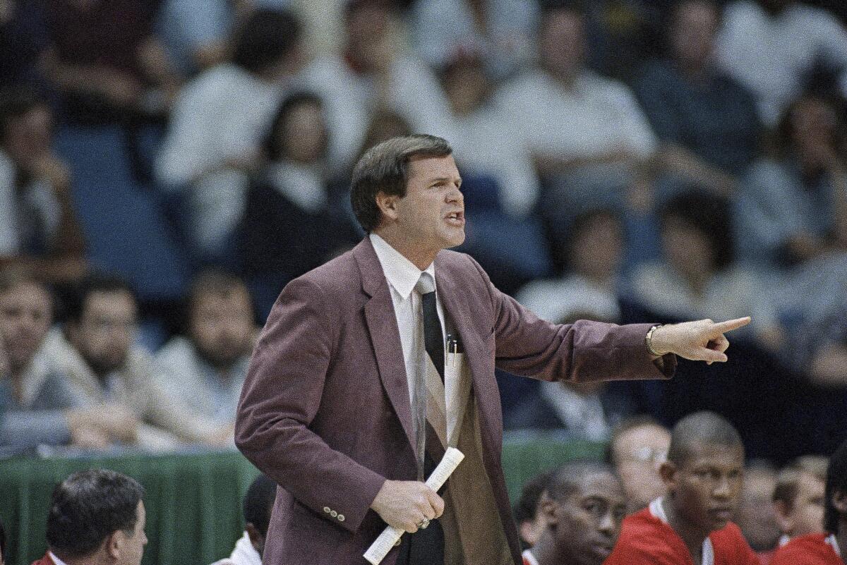 Louisville's Denny Crum coaches from the sideline during an NCAA tournament game against LSU in 1986.