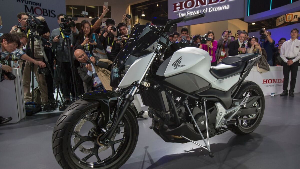 People look at the new Riding Assist concept motorcycle during the recent CES at the Las Vegas Convention Center. This is not necessarily the type of motorcycle that might be subject to a noise tax.