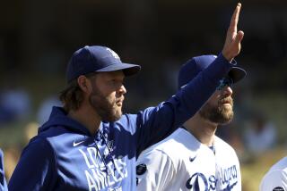 Los Angeles, CA - October 19: Los Angeles Dodgers pitcher Clayton Kershaw waves to the crowd before game three in the 2021 National League Championship Series against the Atlanta Braves at Dodger Stadium on Tuesday, Oct. 19, 2021 in Los Angeles, CA. (Robert Gauthier / Los Angeles Times)