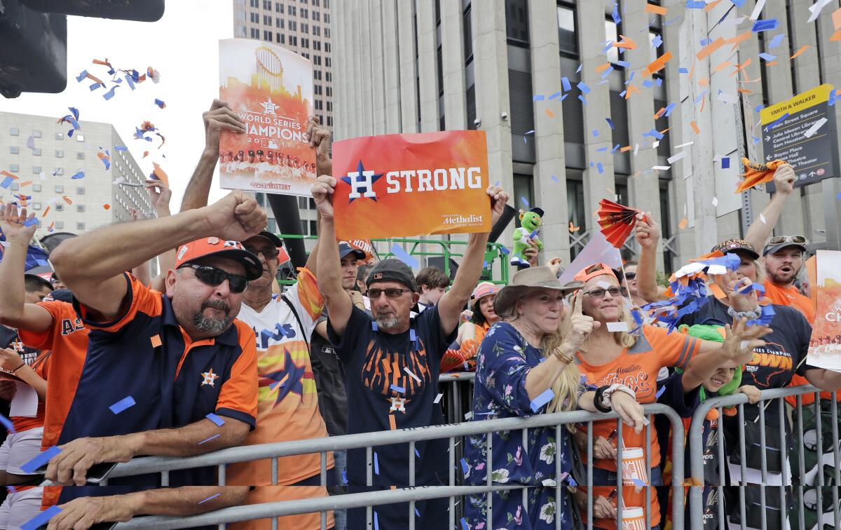Houston Astros fans celebrate during the team's World Series championship parade in November 2017.