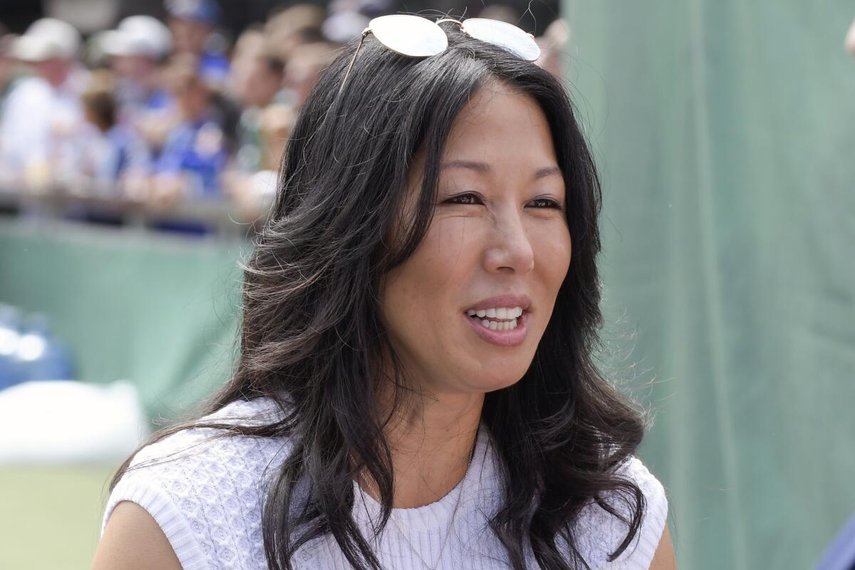 Buffalo Bills co-owner Kim Pegula speaks to a colleague before a game.
