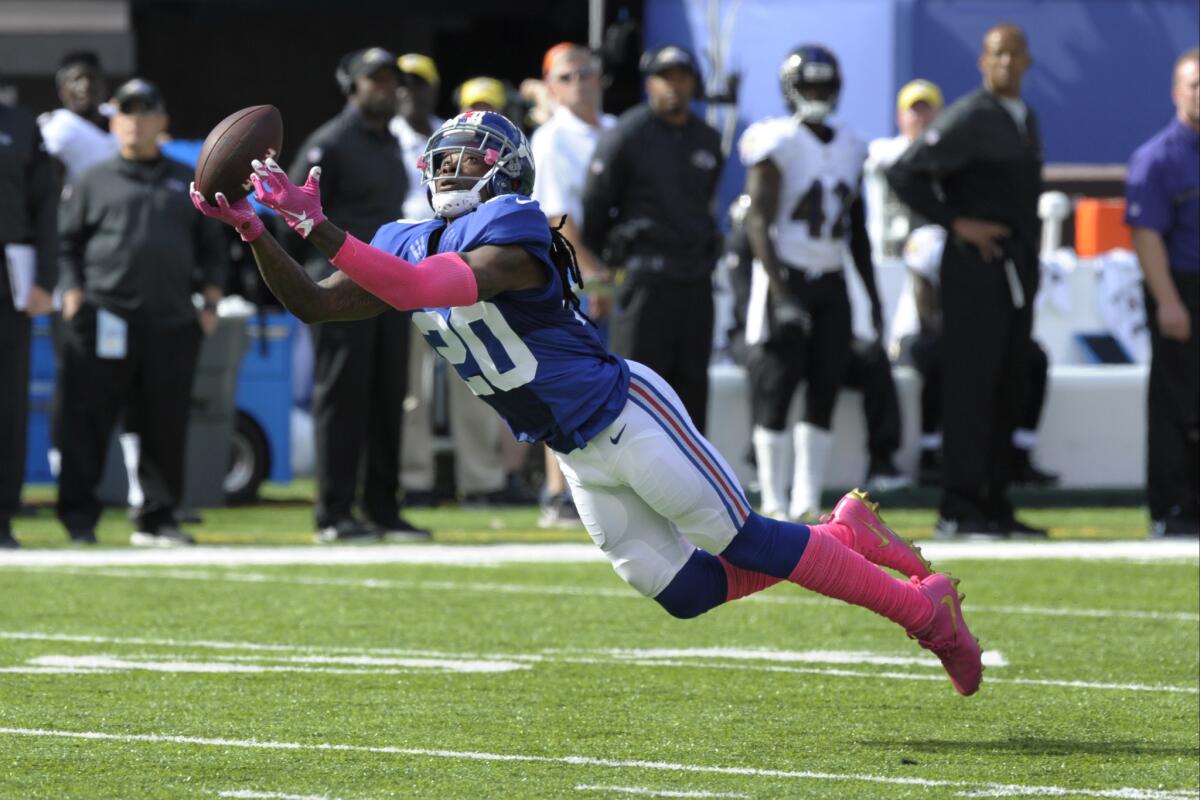 Giants cornerback Janoris Jenkins (20) dives to catch a pass during the first half of a game against the Ravens on Oct. 16.