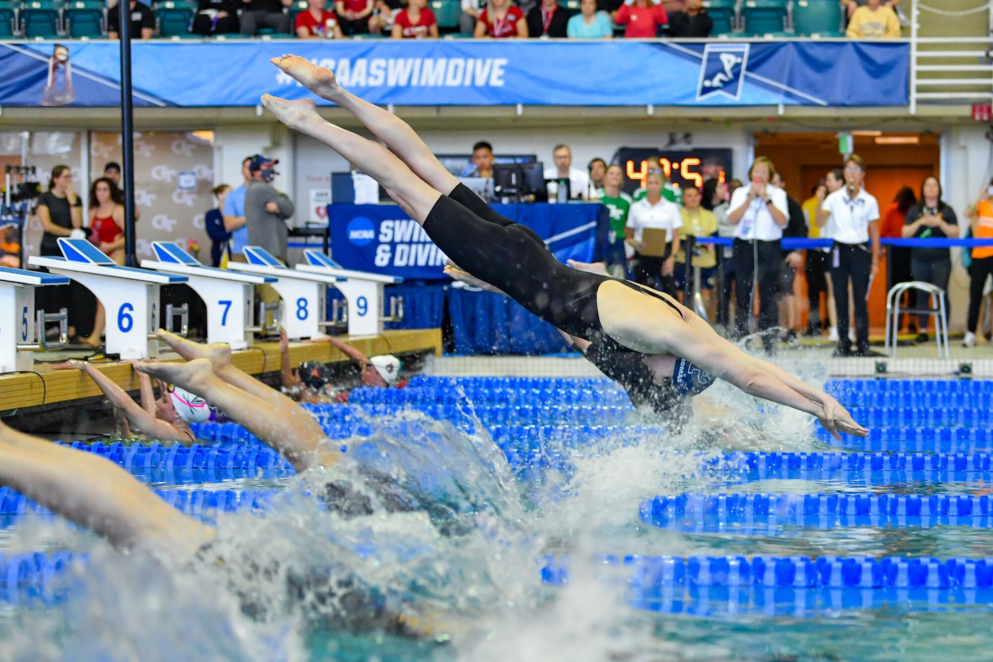 University of Pennsylvania swimmer Lia Thomas dives off the starting block.