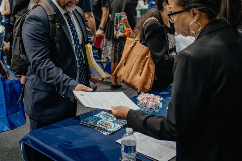 Recruiters and job seekers during a job fair in Chicago, Illinois. Photographer: Jamie Kelter Davis/Bloomberg