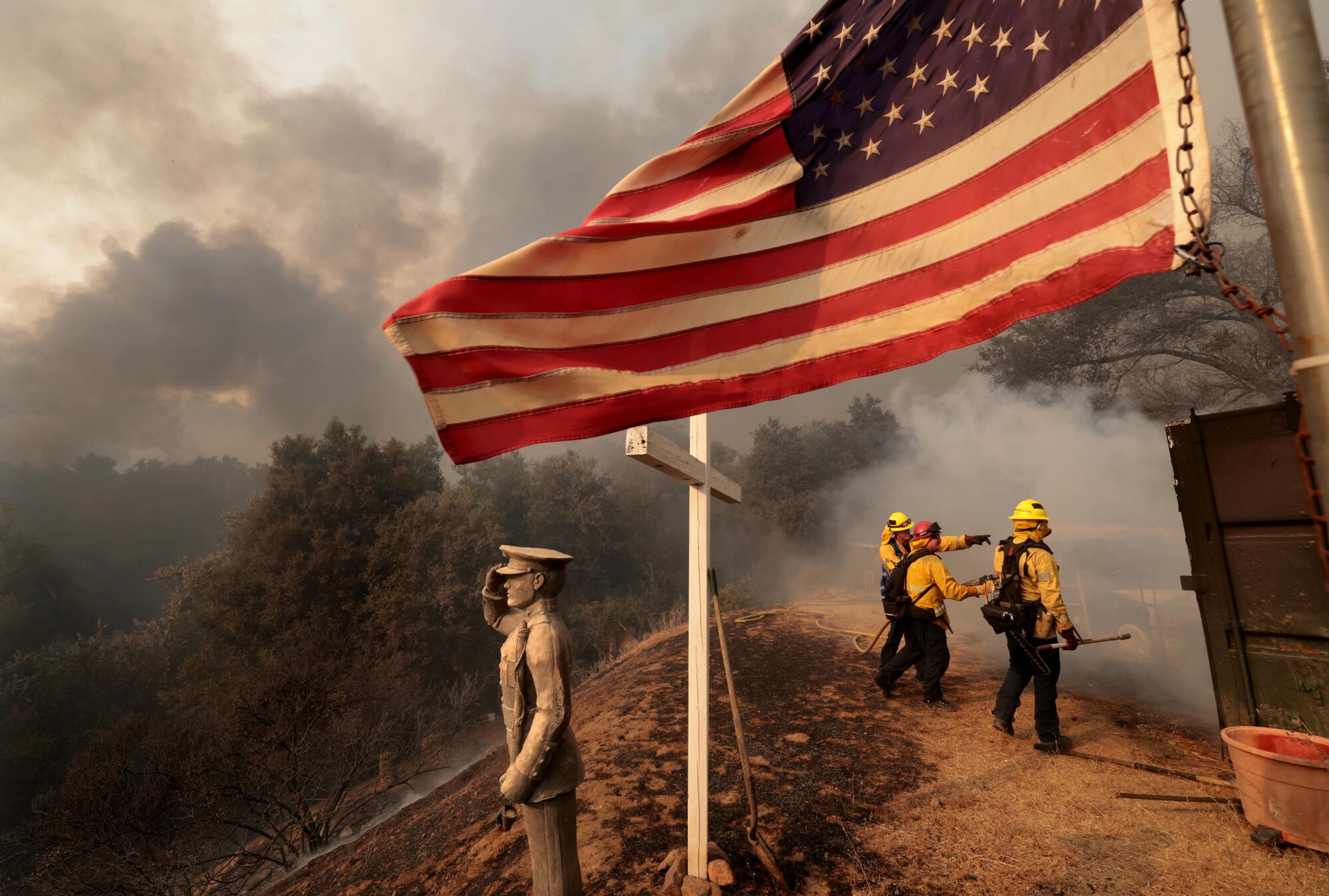 Orange County firefighters from Engine 126 battle the Airport fire along Ortega Highway in the Santa Ana Mountains.