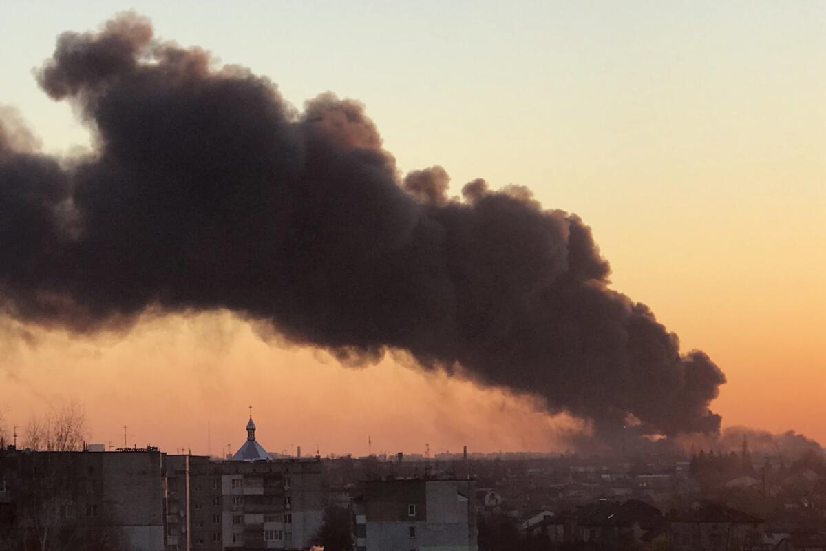 A cloud of smoke rises after an explosion in Lviv in western Ukraine on March 18.