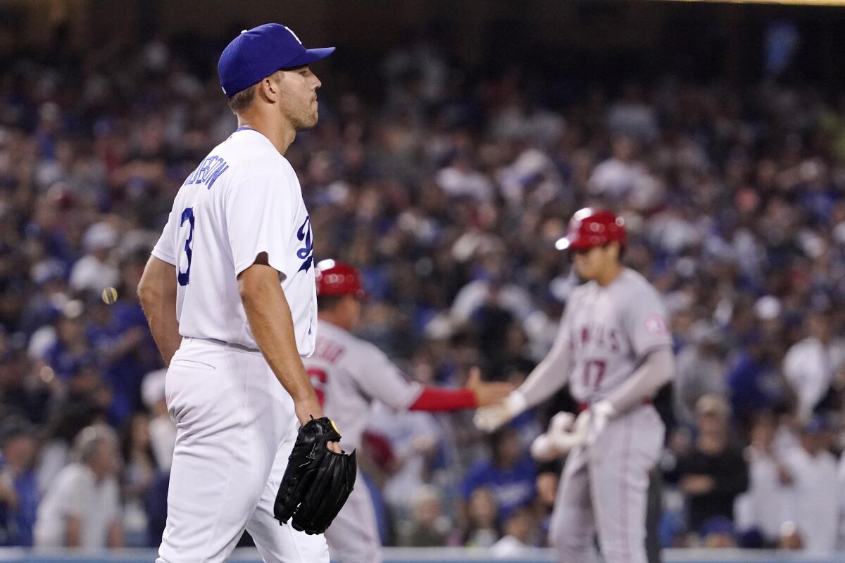 Dodgers' Tyler Anderson walks back to the mound after giving up a triple to Angels' Shohei Ohtani on June 15, 2022.