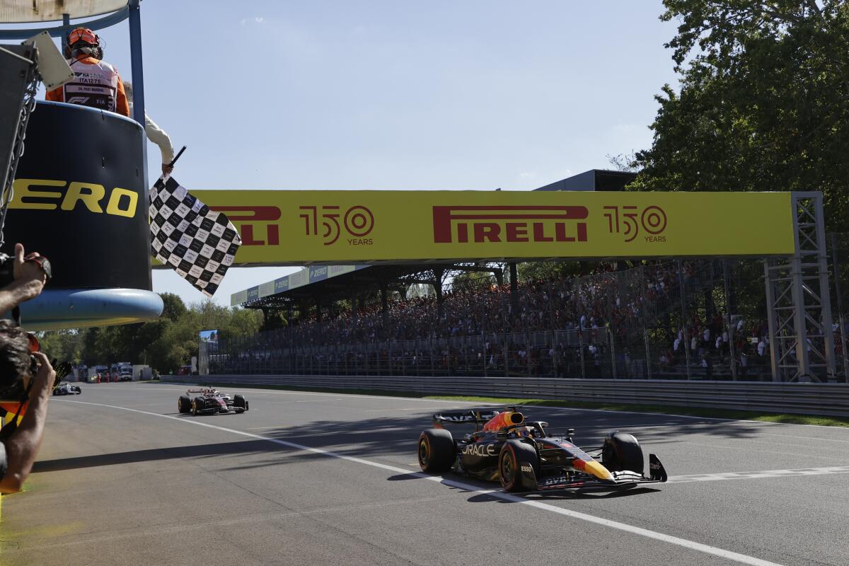 Max Verstappen's car crosses the finish line at the Italian Grand Prix.