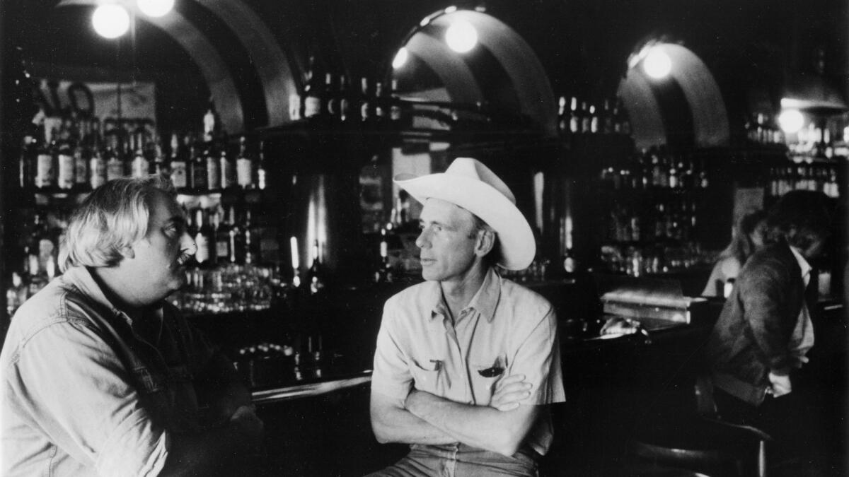 Writer Thomas McGuane, right, with artist Russell Chatham in a bar in Livingston, Montana. August 1987.