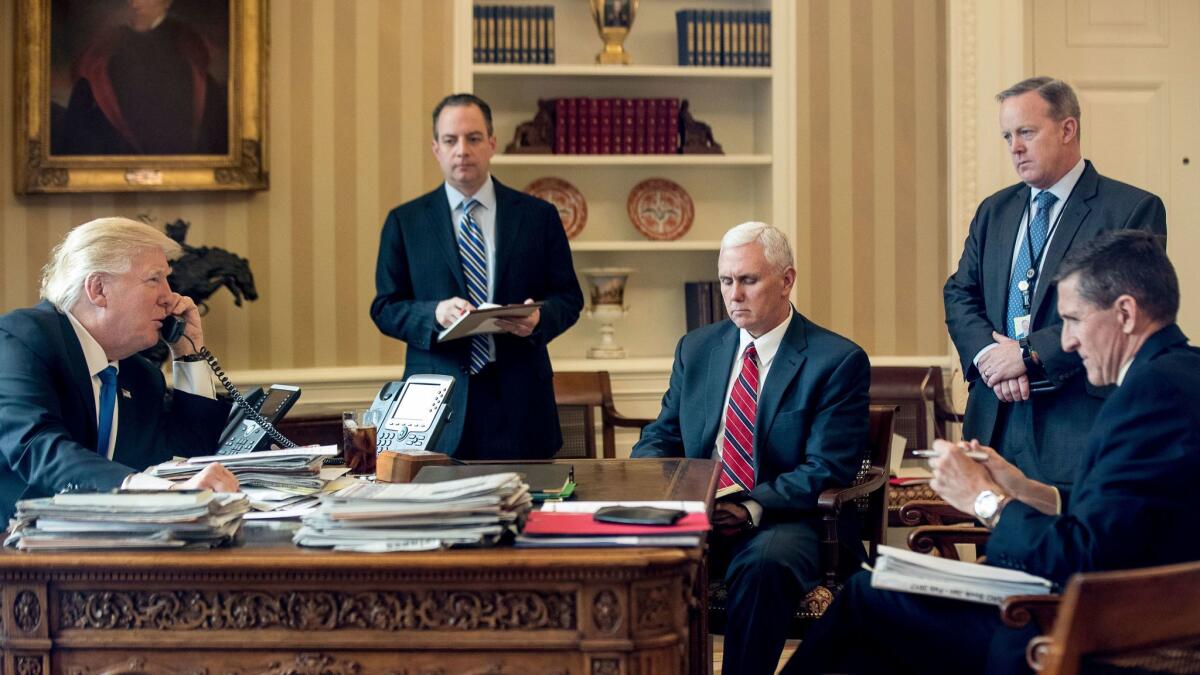 President Trump speaks on the phone with Russian President Vladimir Putin in the Oval Office on Jan. 28.