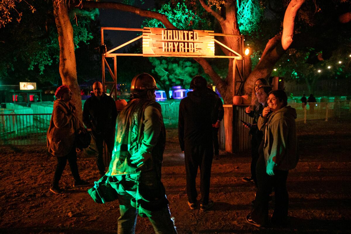 People begin to line up at the Haunted Hayride in Griffith Park.