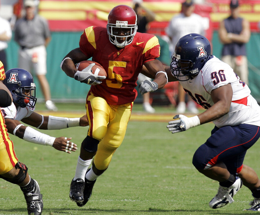 USC's Reggie Bush rushes during a game against Arizona on Oct. 8, 2005 at the Coliseum.