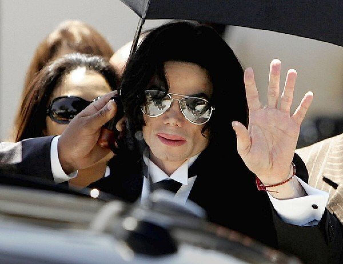 Pop singer Michael Jackson walks out of the Santa Maria Courthouse in2005.