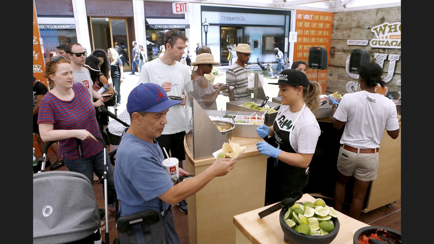 Photo Gallery: Wholly Guacamole's Guac Stop pop up restaurant gives out free samples of guacamole at Americana at Brand