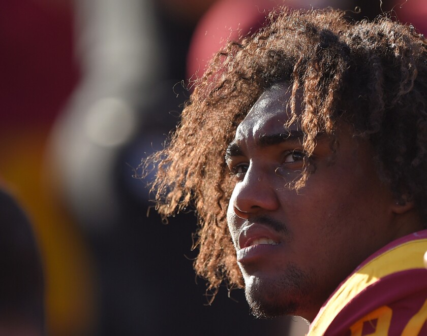 USC defensive end Leonard Williams looks on from the bench during the second half of the Trojans' 49-14 win over Notre Dame on Nov. 29. at the Coliseum.