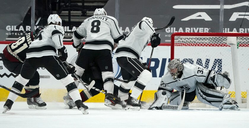 Arizona Coyotes right wing Phil Kessel gets the puck past Kings defenders.