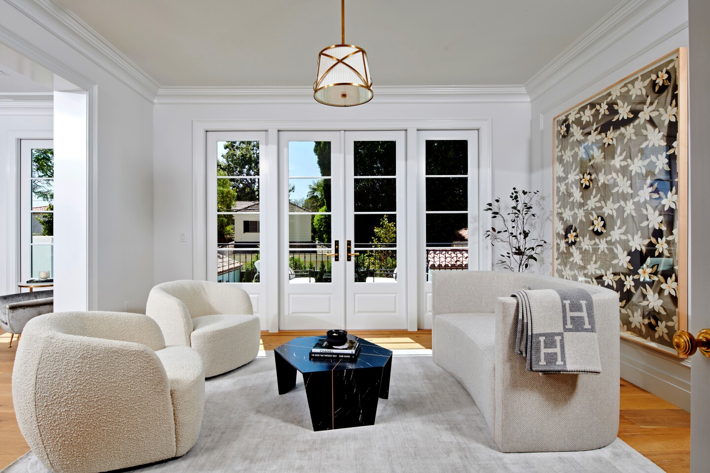 Built by Sater Development, the Georgian-inspired traditional home has more than 6,300 square feet of refined living space, a living room with an antique marble fireplace and a subdued study with a wet bar. Ralph Lauren lighting brightens the chef's kitchen, which is outfitted with professional-grade appliances. A garden-view family room sits off the kitchen area. Wellness amenities such as a gym with a Peleton exercise bike and a Scandinavian hydrotherapy circuit are among health-conscious features of the newly built home on North Sierra Drive. Listed for $12.195 million, the Beverly Hills abode comes with three months worth of twice-weekly yoga lessons. Cold-pressed juice deliveries by a juiceologist are also included in the sale price.