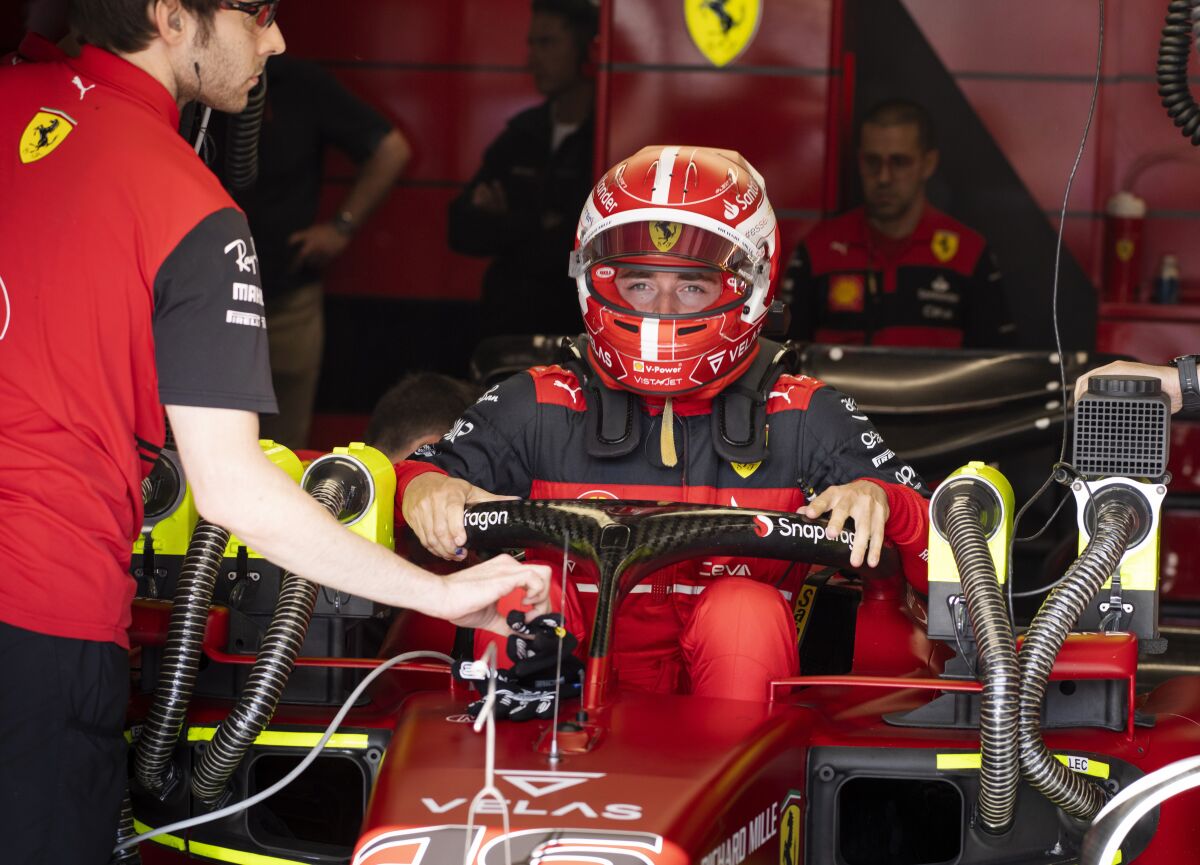 Ferrari driver Charles Leclerc, of Monaco, gets into his car in the garage during the second practice session for the Formula One Canadian Grand Prix auto race in Montreal, Friday, June 17, 2022. (Paul Chiasson/The Canadian Press via AP)