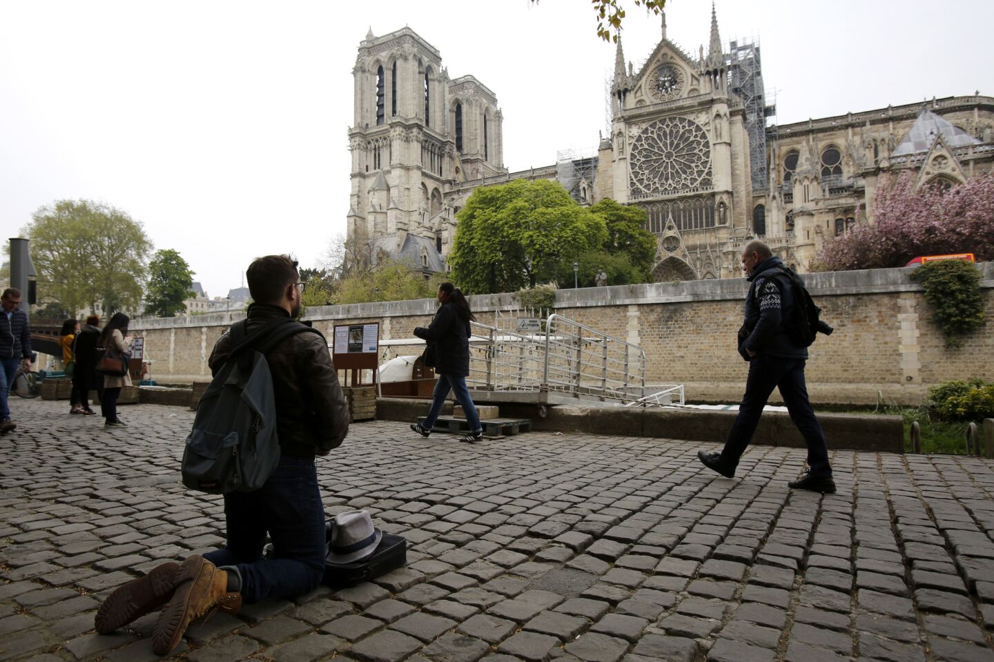 Visitors came to see and photograph the damage at Notre Dame.