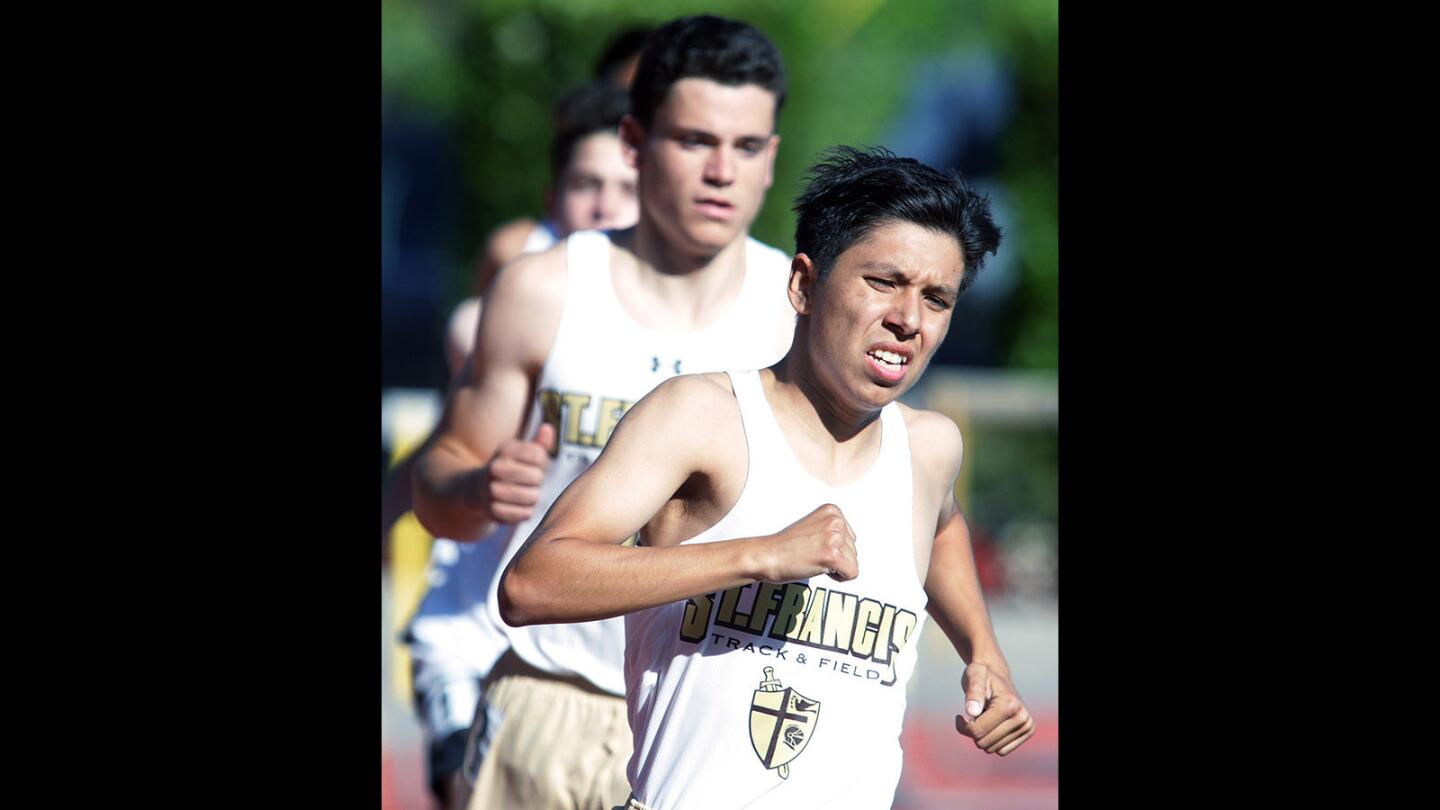 St. Francis' Chris Rodriguez leads the pack on his way to win the 800 at a track meet at St. Francis High School on Thursday, April 21, 2016.