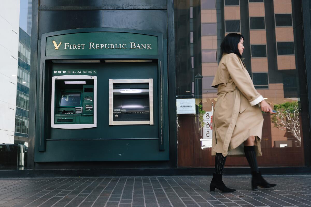 A person passes the First Republic Bank in downtown Los Angeles.