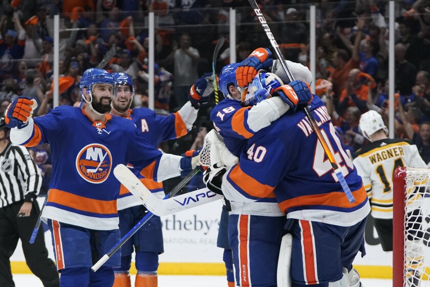 New York Islanders goaltender Semyon Varlamov (40) celebrates with teammates after of Game 6 in an NHL hockey second-round playoff series against the Boston Bruins Wednesday, June 9, 2021, in Uniondale, N.Y. The Islanders won 6-2. (AP Photo/Frank Franklin II)