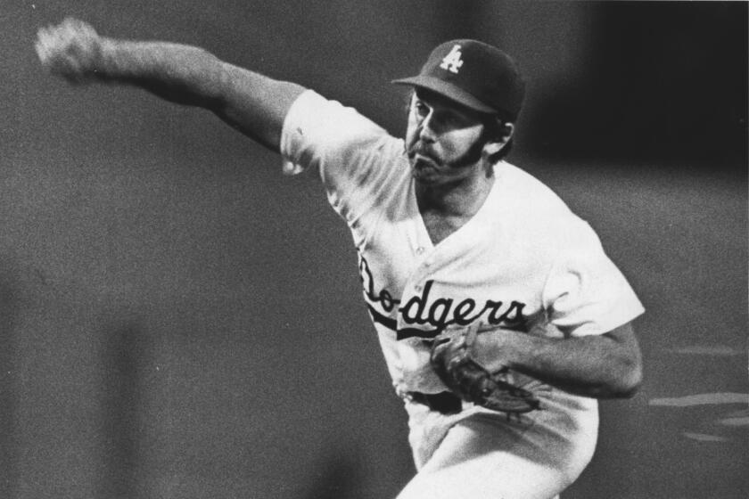 Mike Marshall of the Dodgers pitches against the Reds April 24, 1975.