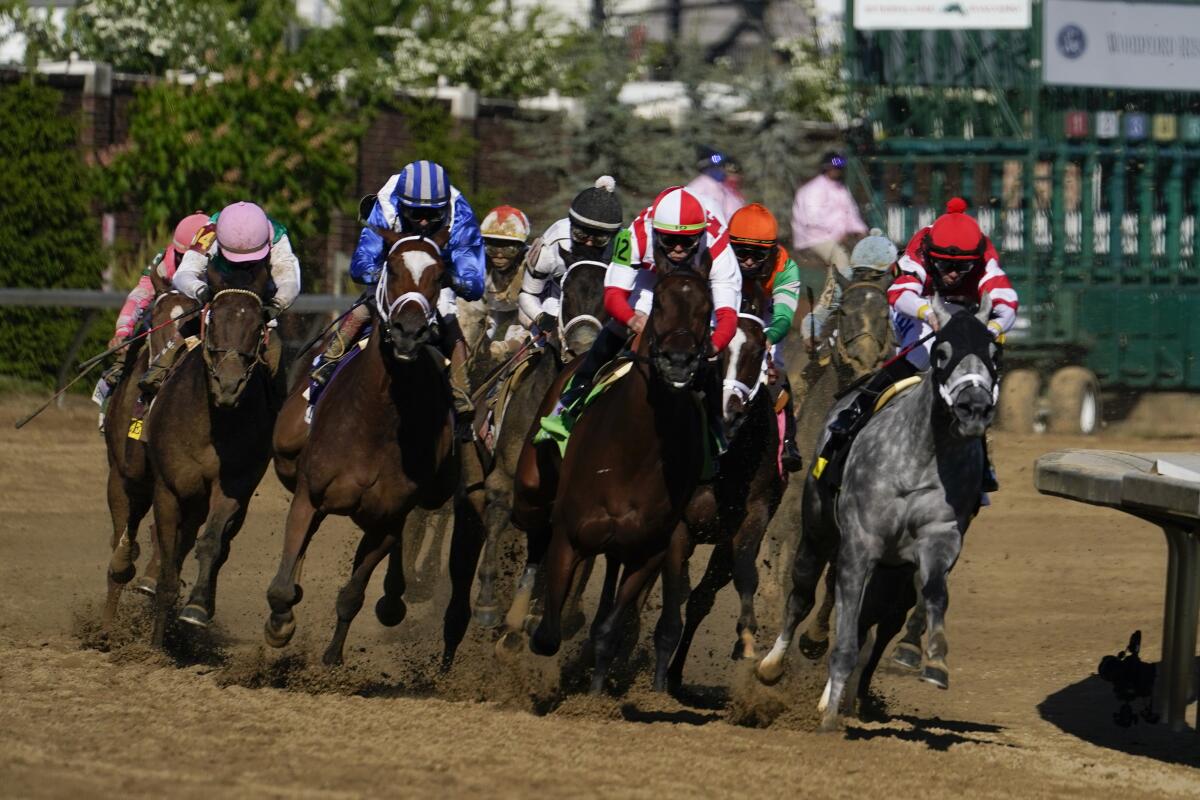 John Velazquez, second from left, rides Malathaat to victory during the 147th running of the Kentucky Oaks.