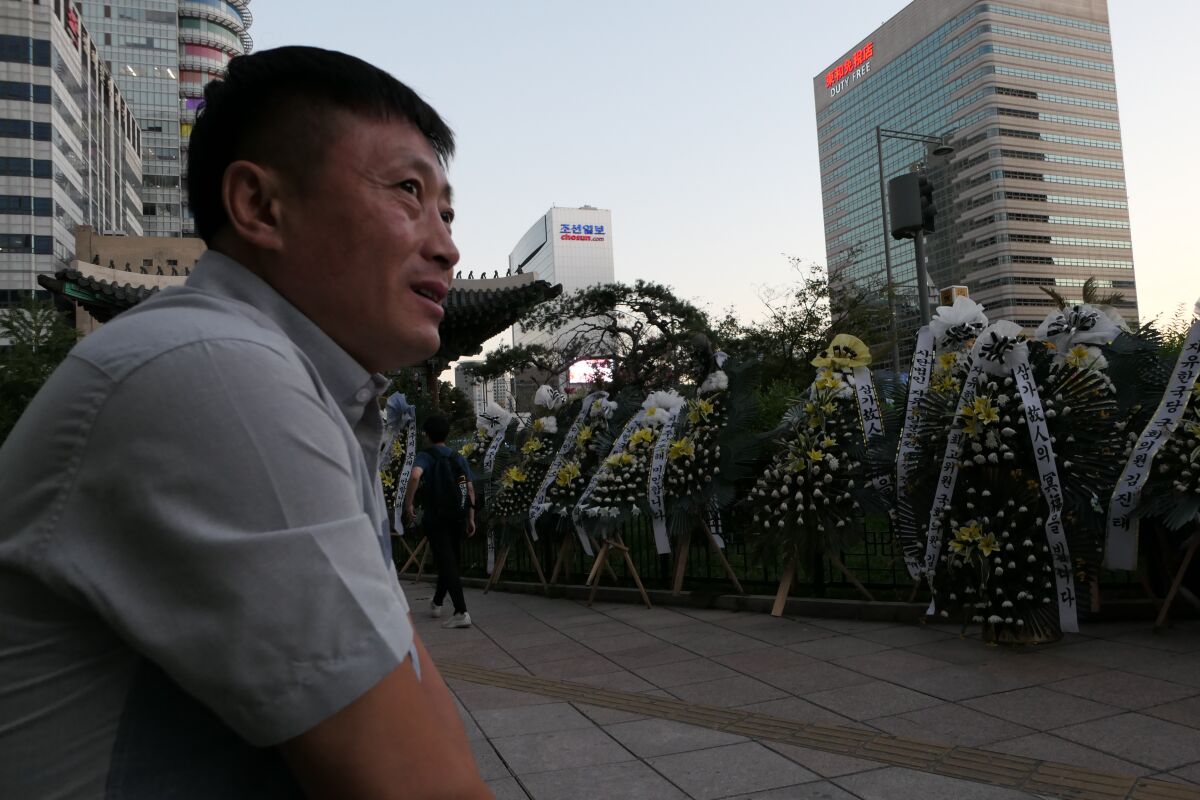 Choi Myung-chul, 39, has been driving more than an hour from his home in Incheon, South Korea, to get to the makeshift memorial for fellow North Korean refugee Han Sung-ok in downtown Seoul. Han and her 6-year-old were found dead in late July in a death some suspect may have been from starvation.
