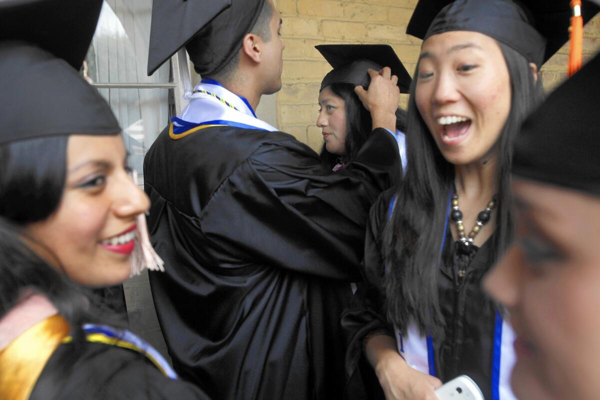 A group of 2012 graduates from UCLA who had been brought to the U.S. illegally as children gather near campus before the ceremony to have their own celebration.
