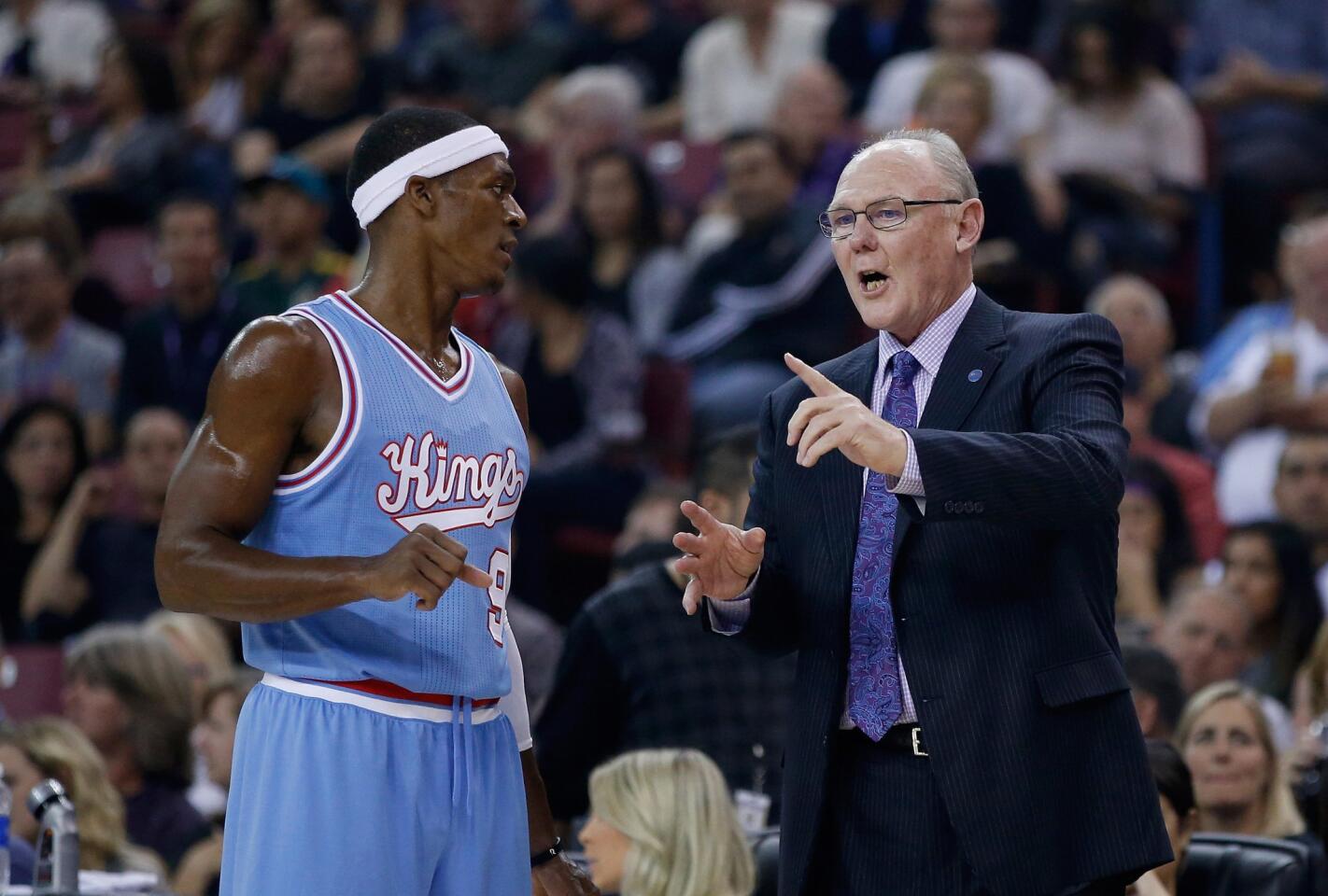 Sacramento Kings head coach George Karl, right, talks to Kings' Rajon Rondo during their game against the Los Angeles Lakers at Sleep Train Arena on Friday.