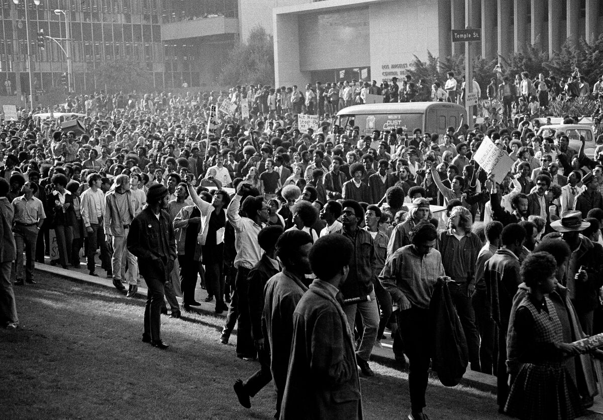 A crowd estimated by police at between one and three thousand chants "Power to the People" while giving a Black Power salute outside Los Angeles' Hall of Justice on Dec. 11, 1969. Demonstrators were protesting what they called harassment of Black Panthers in recent raids by police.
