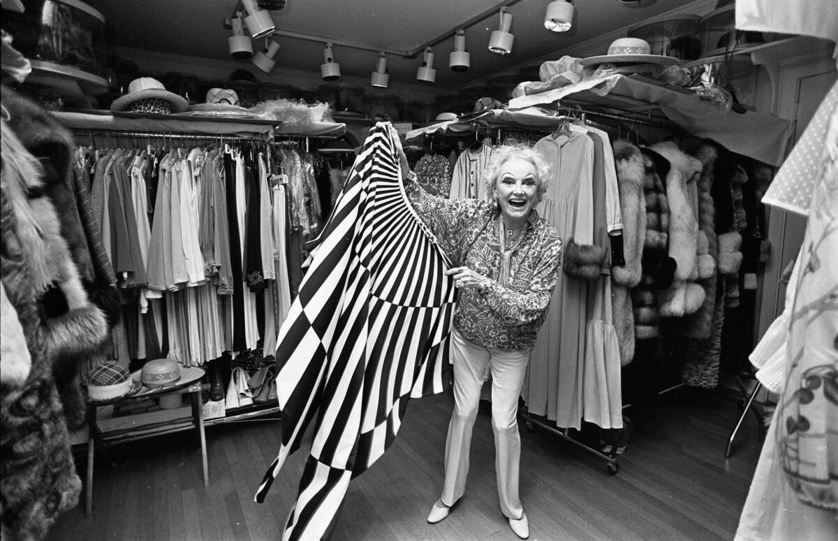 Comedian Phyllis Diller surveying her wardrobe in her 18x30-foot closet in 1978.