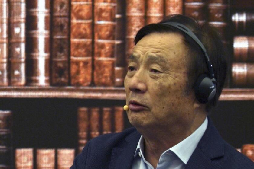 Huawei founder Ren Zhengfei speaks at a roundtable at the telecom giant's headquarters in Shenzhen in southern China on Monday, June 17, 2019. Huawei's founder has likened his company to a badly damaged plane and says revenues will be $30 billion less than forecast over the next two years. (AP Photo/Dake Kang)