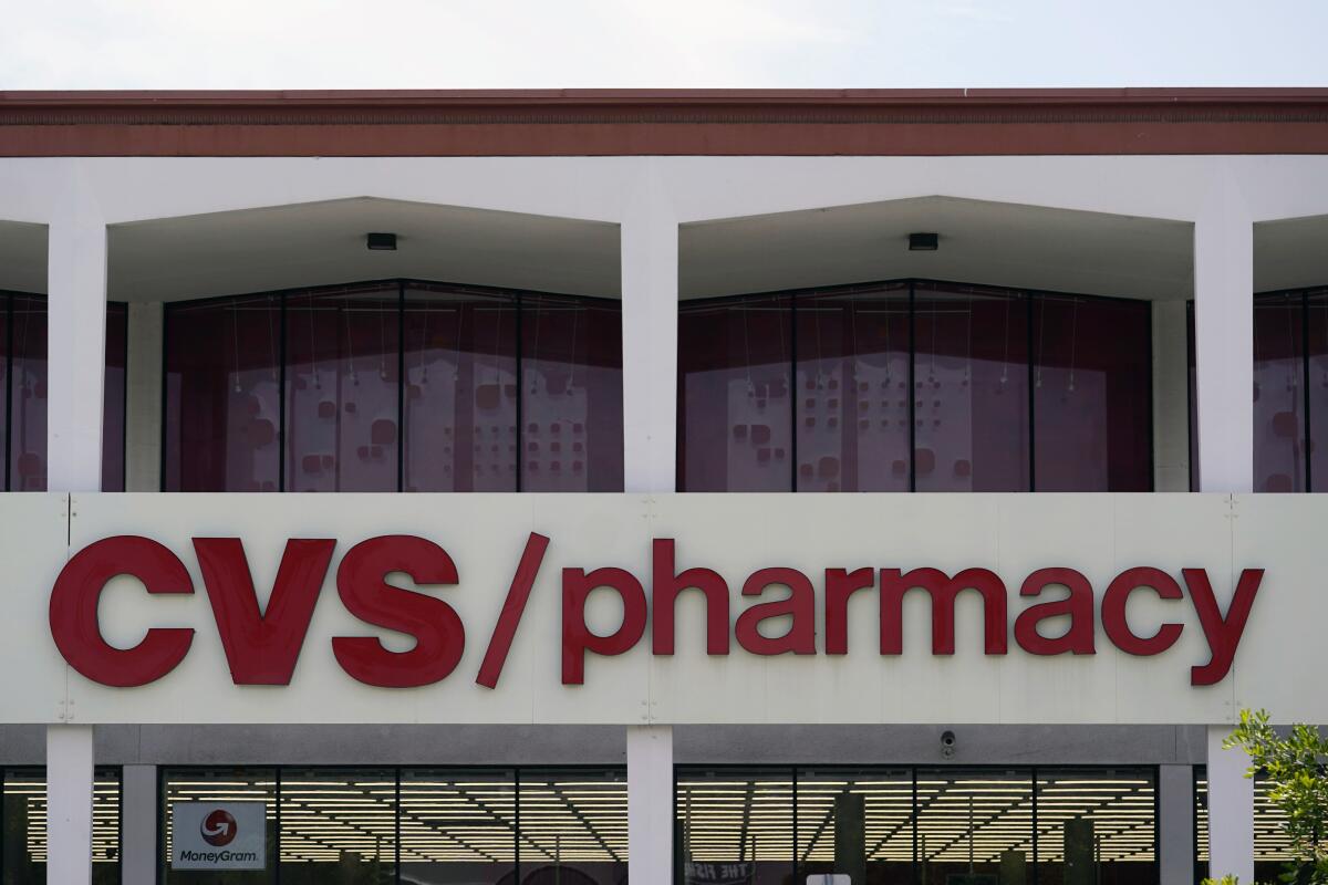 A red sign on a CVS pharmacy in Pasadena.